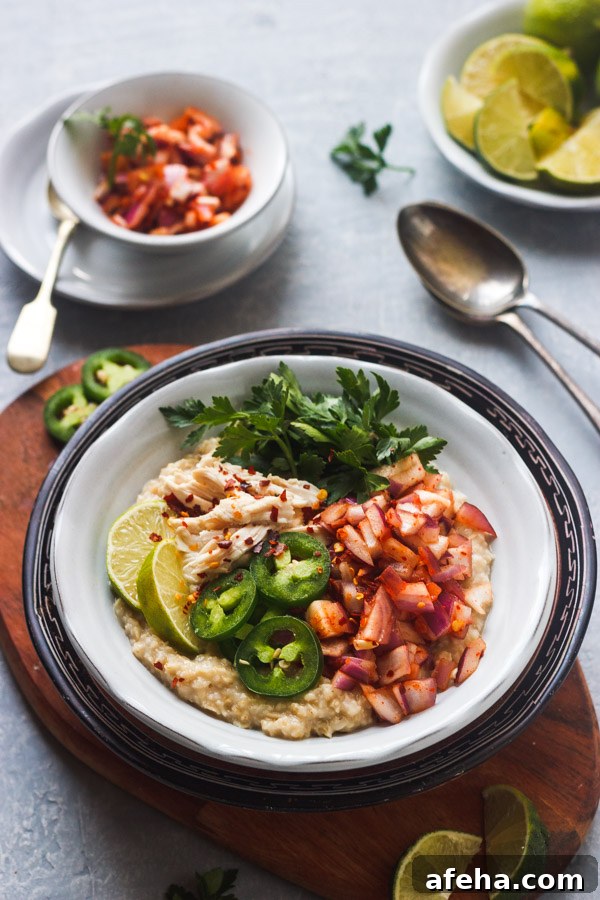 Sri Lankan oatmeal topped with topped with chicken, onion sambal and parsley.