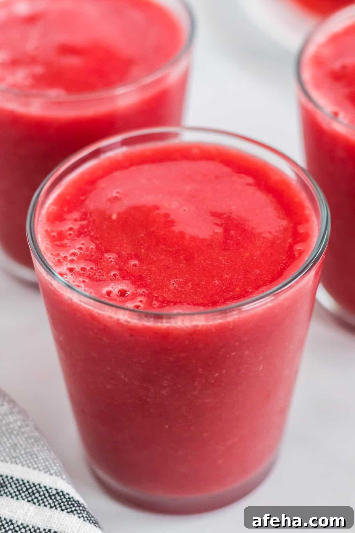 strawberry watermelon smoothie in a clear glass