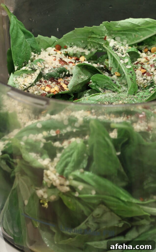 Creamy Vegan Pesto Without Nuts — Flavorful Plant-Based Sauce 5 Pesto ingredients in food processor