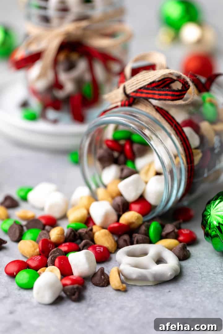 Christmas Trail Mix: Sweet and Salty Holiday Snack Recipe 3 Snack mix spilled from a jar.