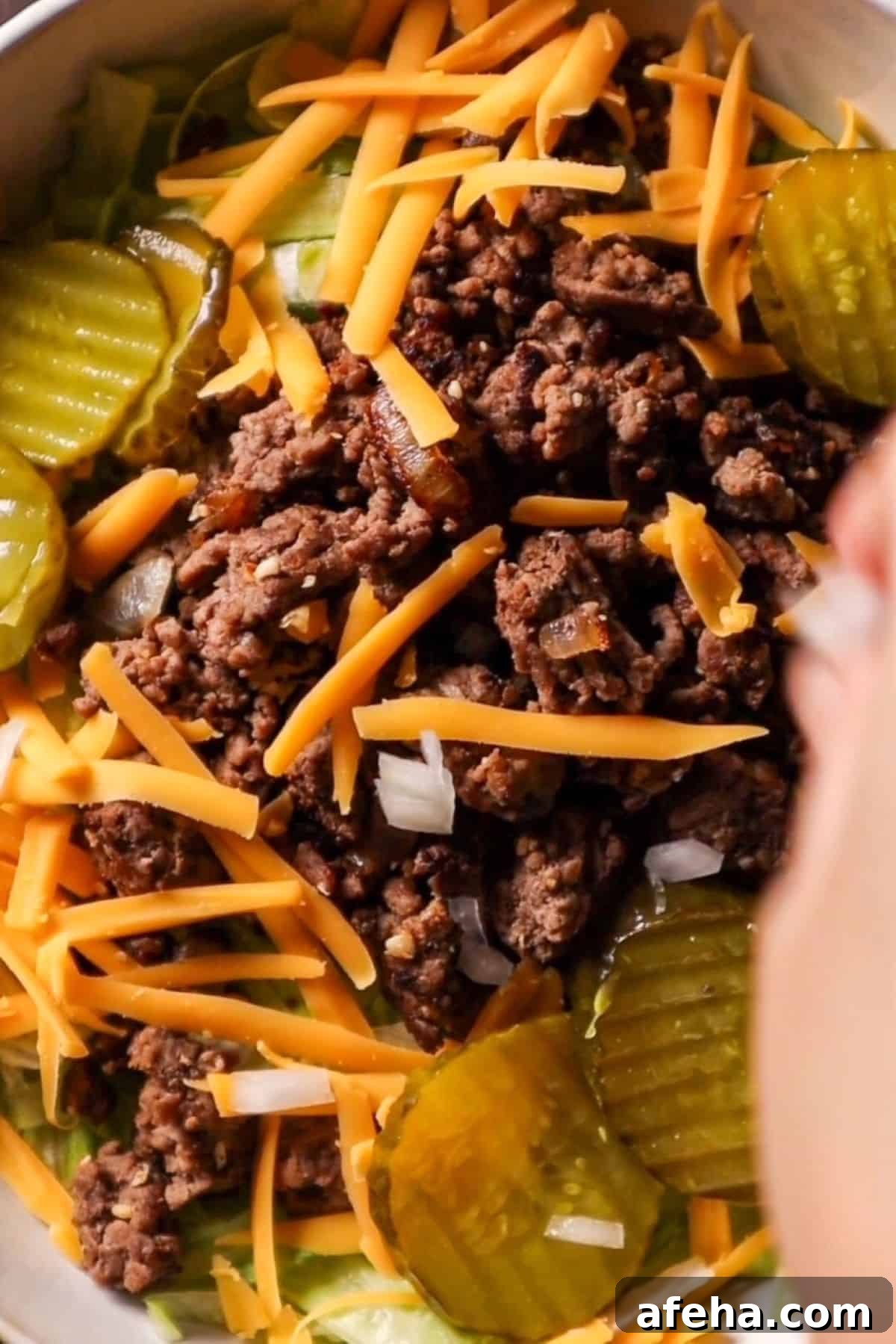 cheese ground beef pickles and ice burg lettuce