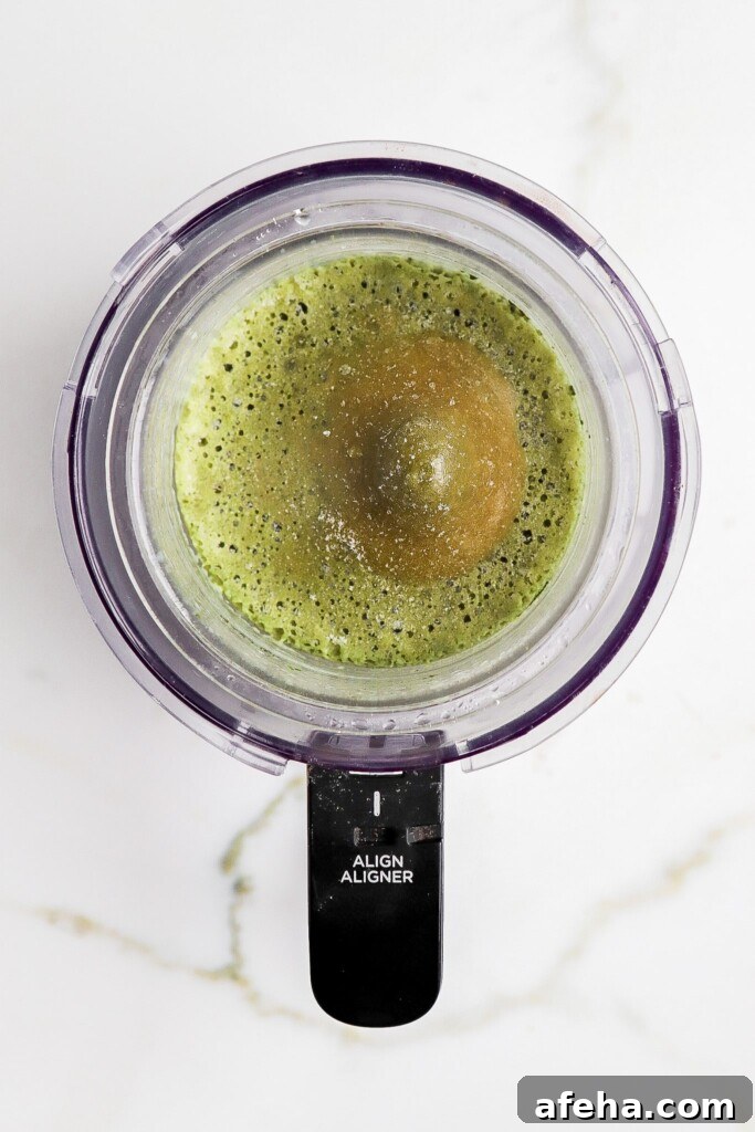 Ninja Creami Matcha Ice Cream: 48g Protein 4 Green matcha ice cream base frozen in a Ninja Creami pint
