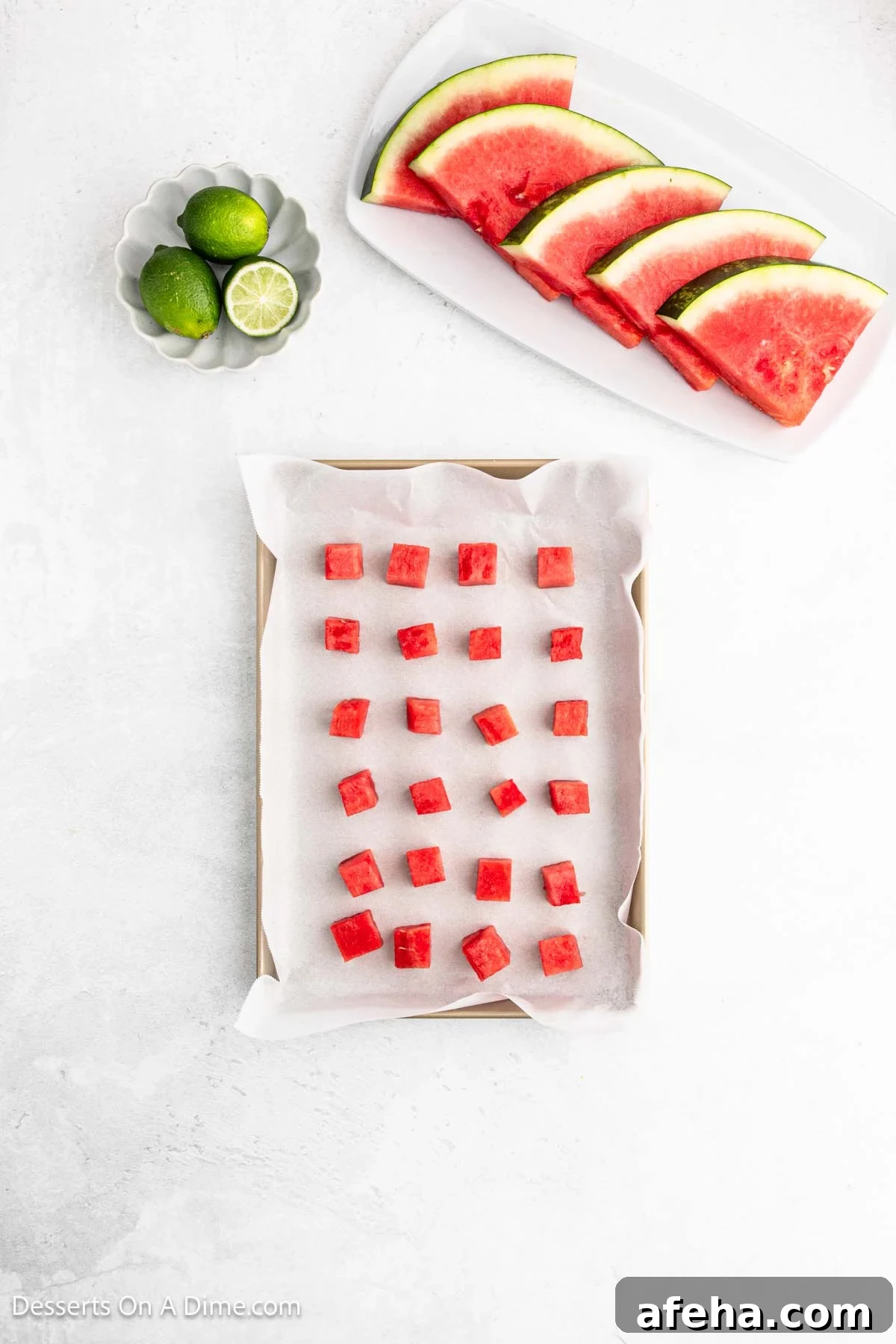 Watermelon cubes on baking sheet.