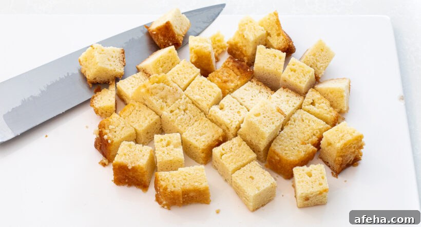 cubed pound cake on white cutting board