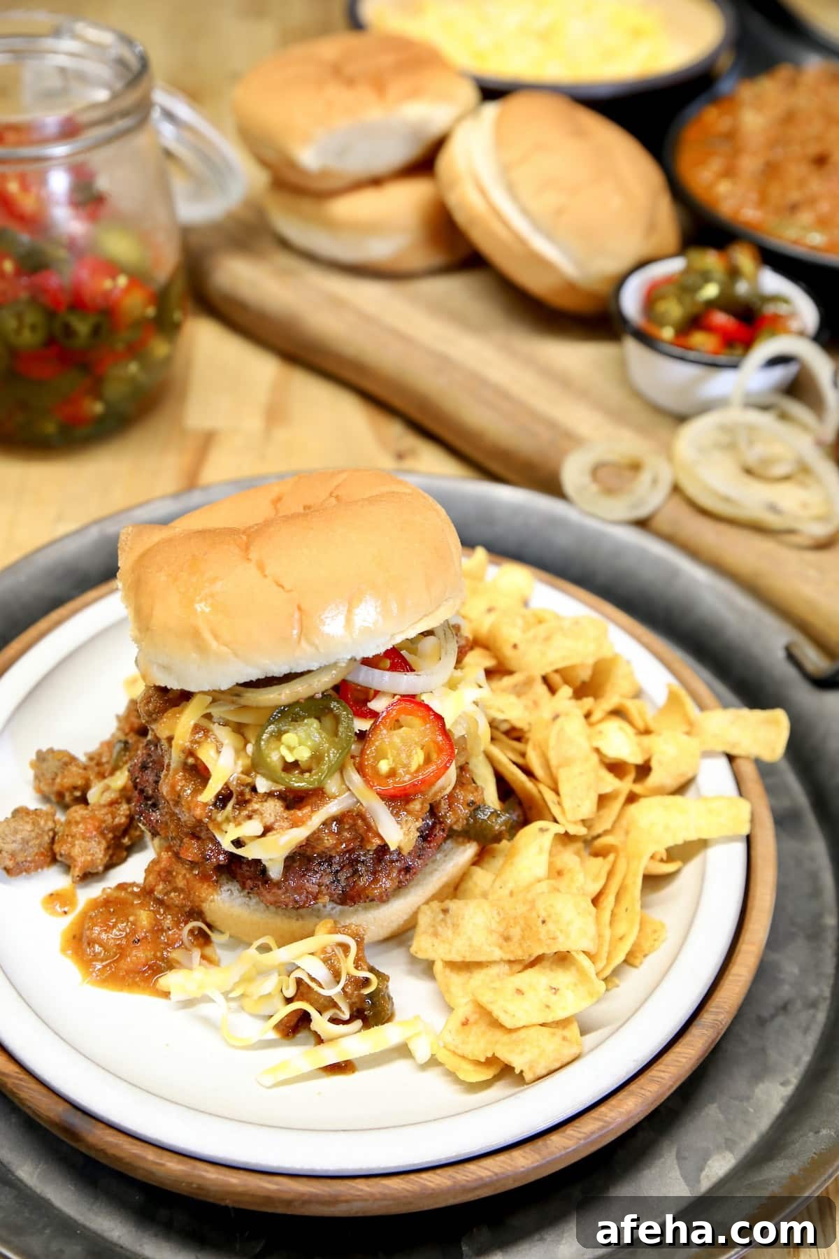 Burger topped with chili and cheese.