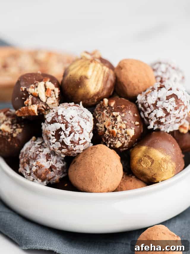 Decadent Homemade Chocolate Truffles Recipe 2 Chocolate candies in a white bowl.