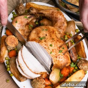 slicing slow cooker chicken which is served on a platter plate with peas, parsnips, carrots, onion and stuffing balls
