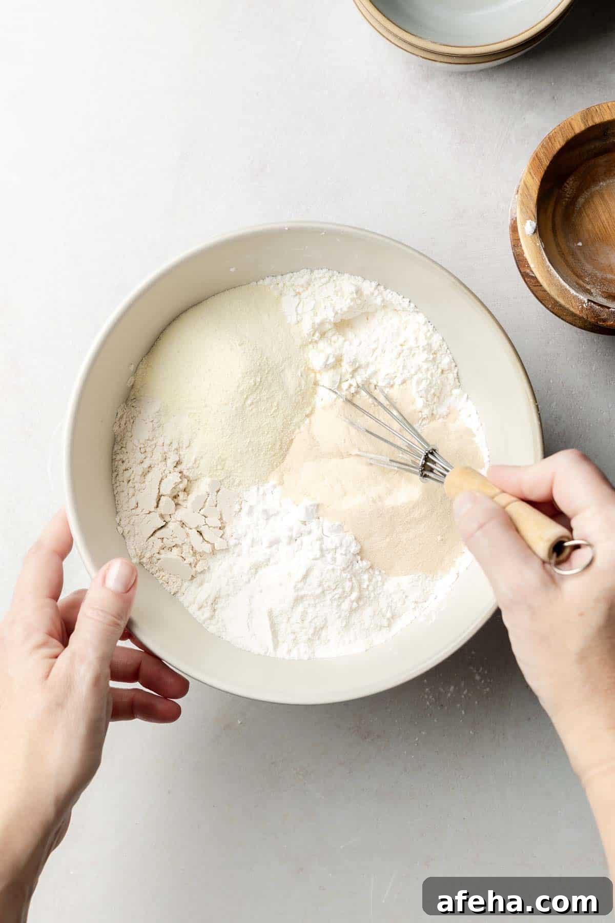 Ingredients in a large mixing bowl with whisk.