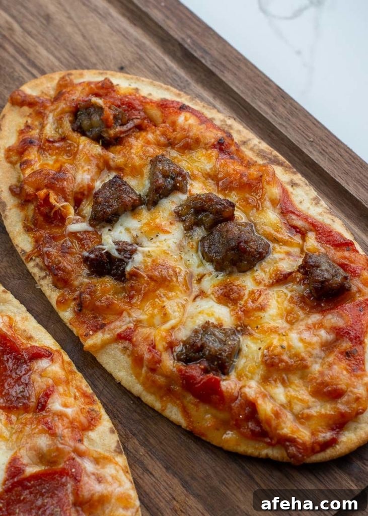 Air fryer pizza cooking with melted cheese