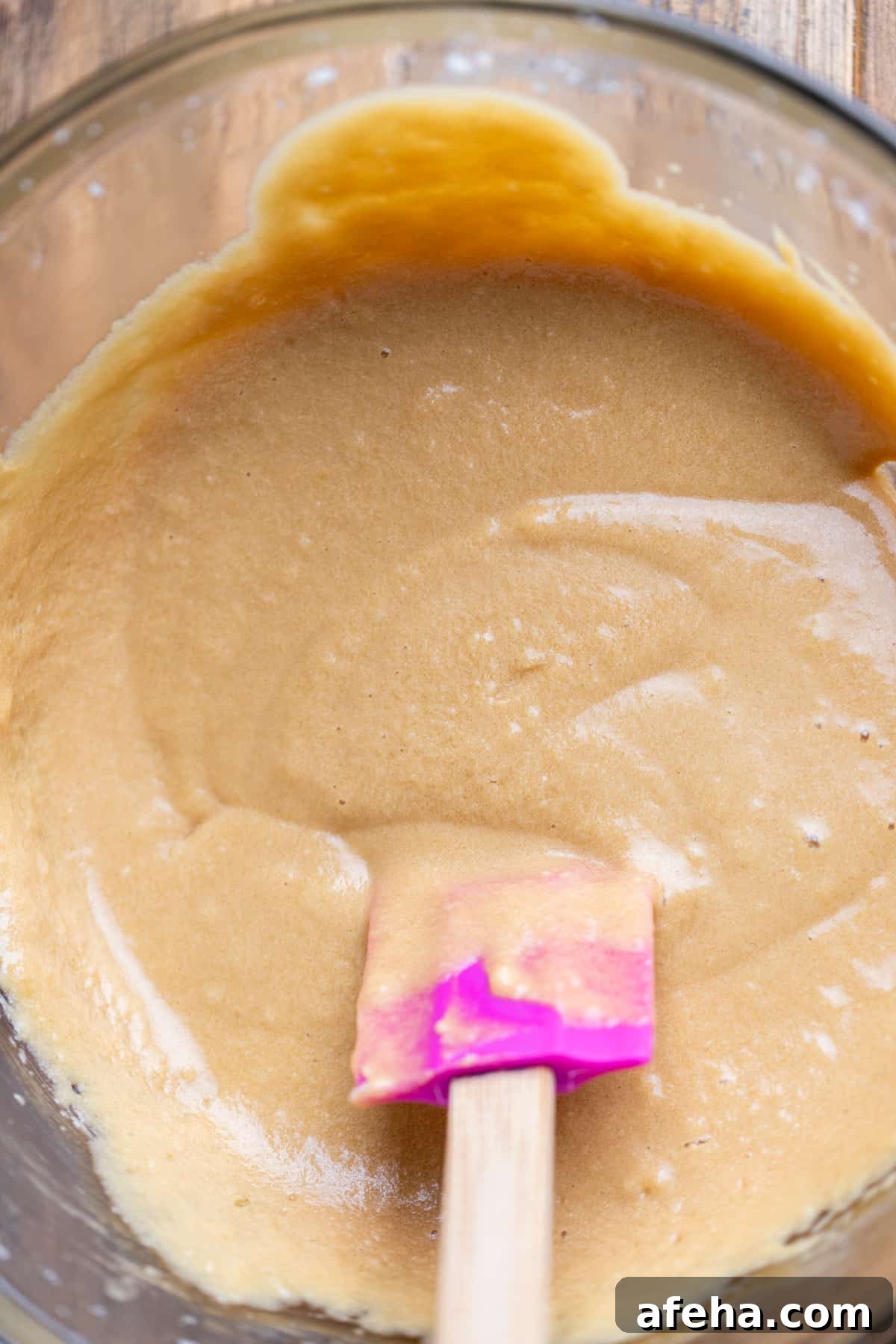 Wet ingredients in a glass bowl.