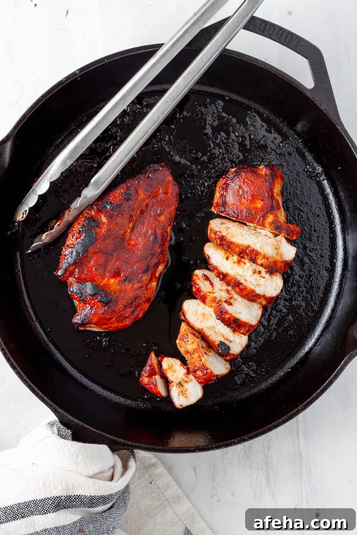 Cast Iron BBQ Chicken Breast Recipe 2 Barbecue chicken breasts in a cast iron skillet.
