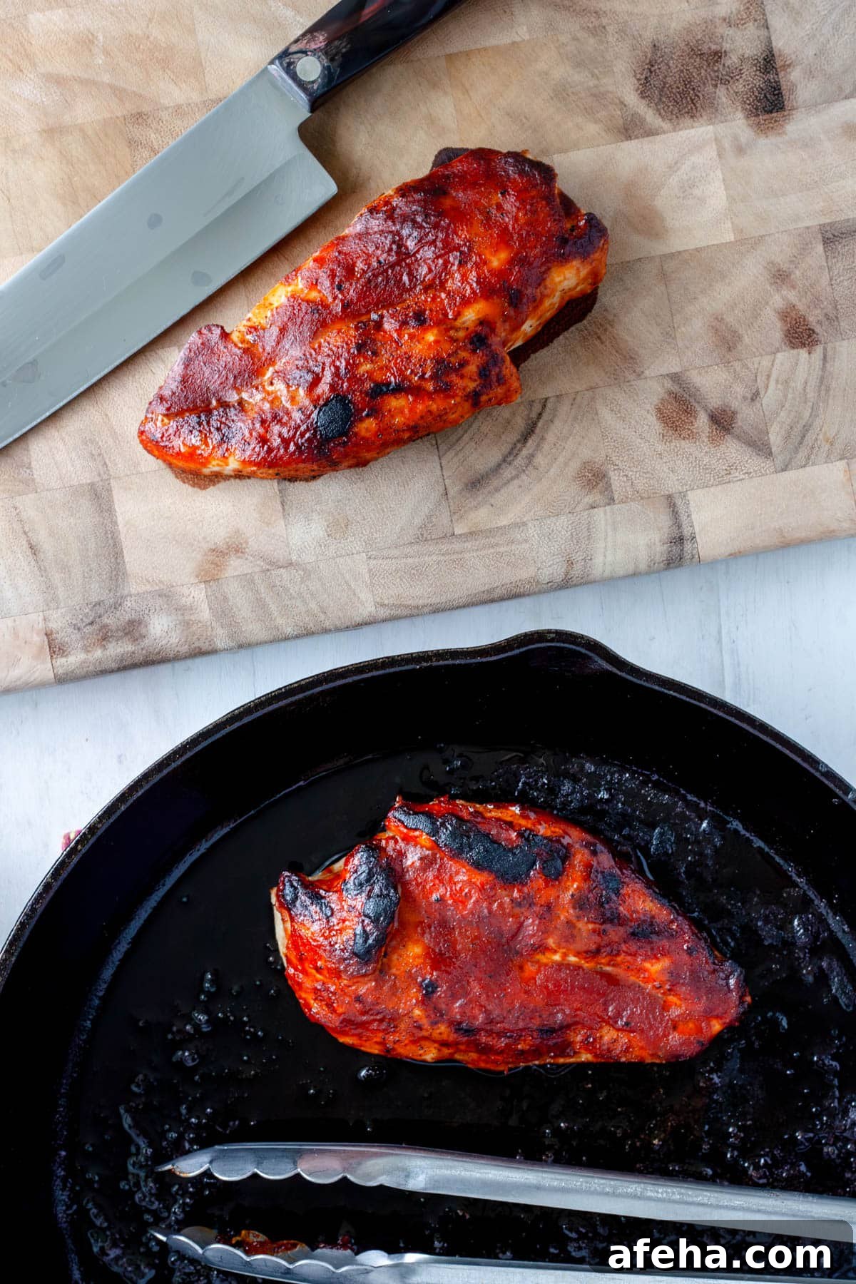 Cast Iron BBQ Chicken Breast Recipe 8 Cast iron chicken breast cooling on a cutting board.