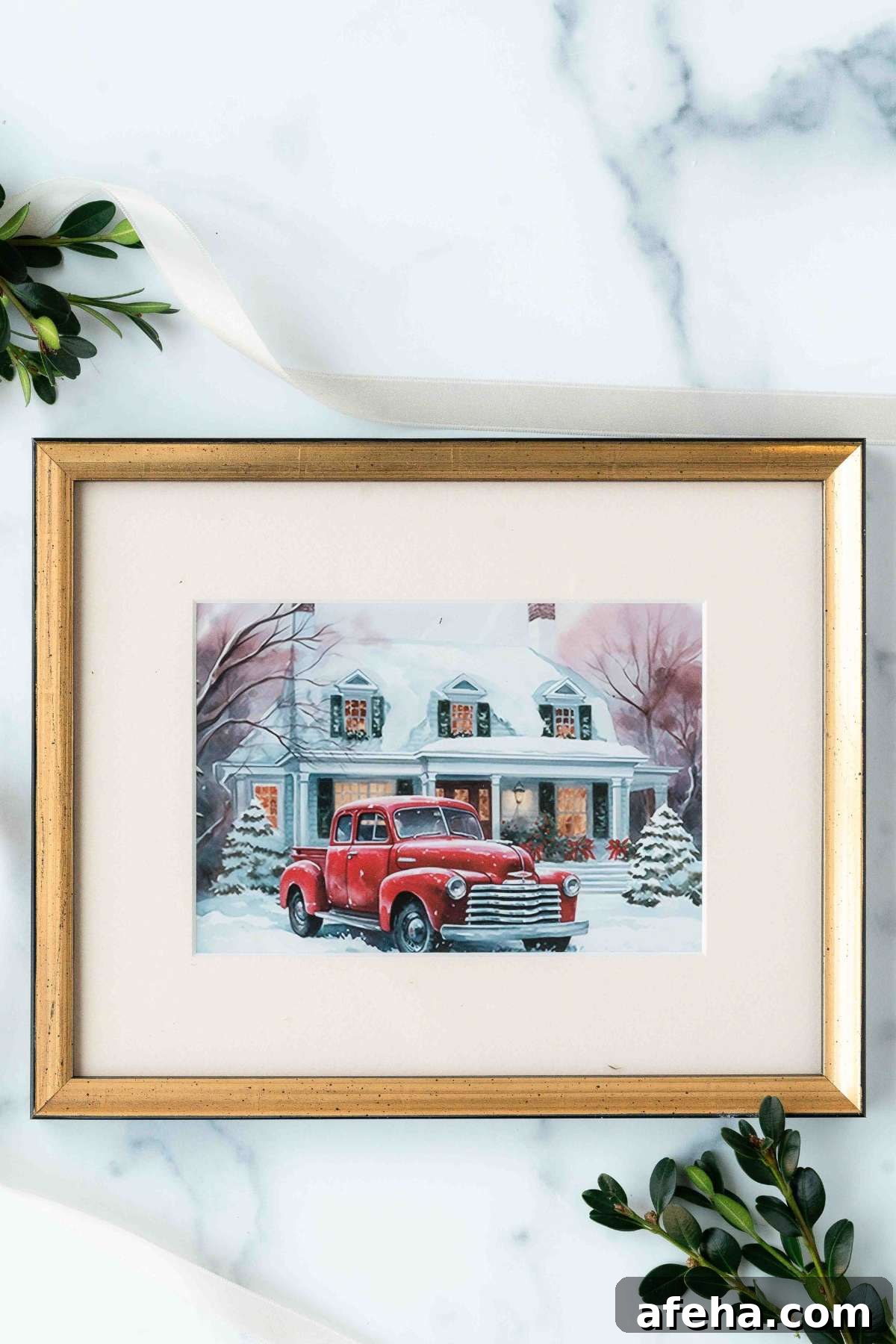 framed watercolor of house with red truck.
