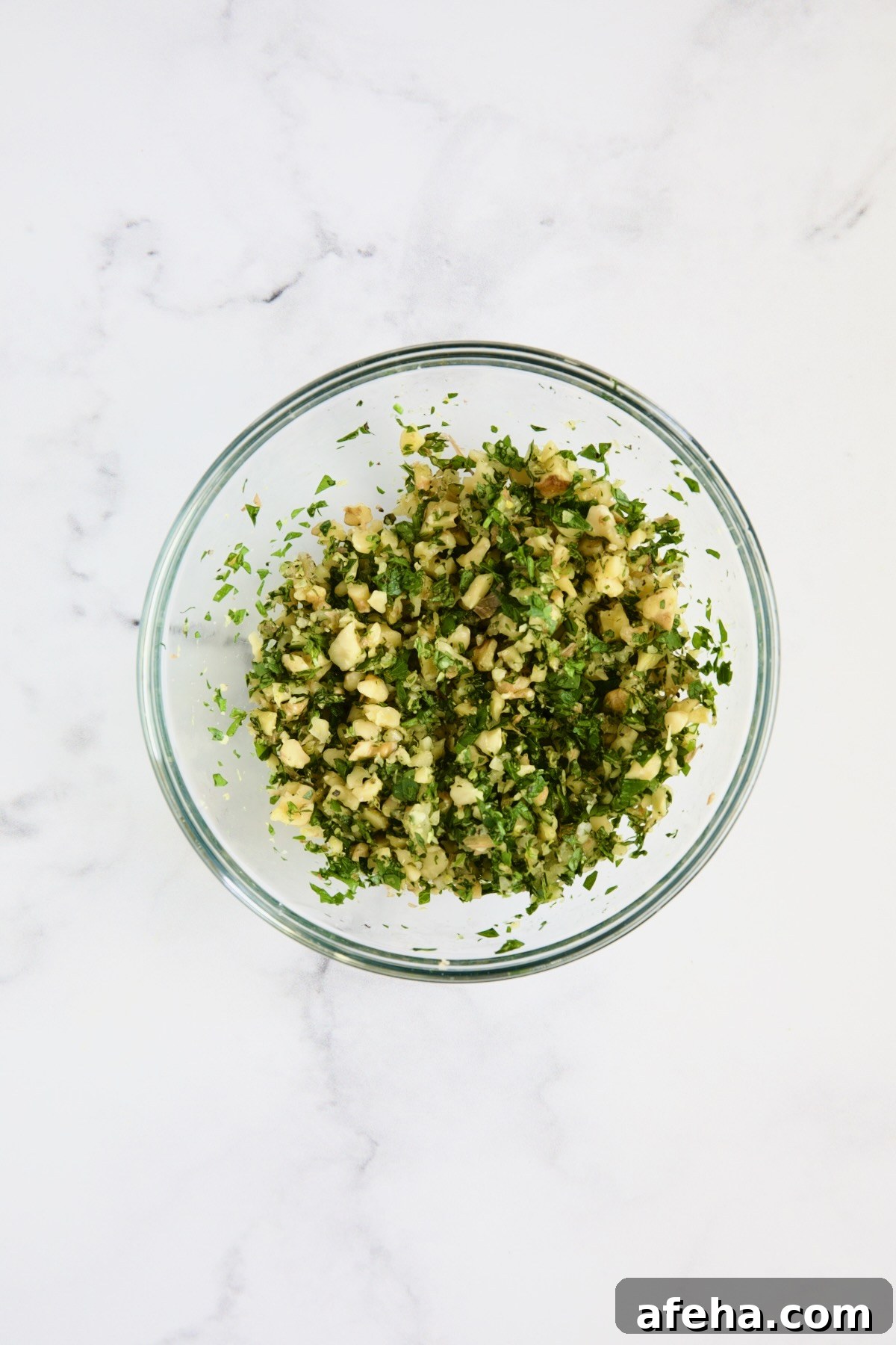 Walnut Lemon Gremolata in glass bowl.